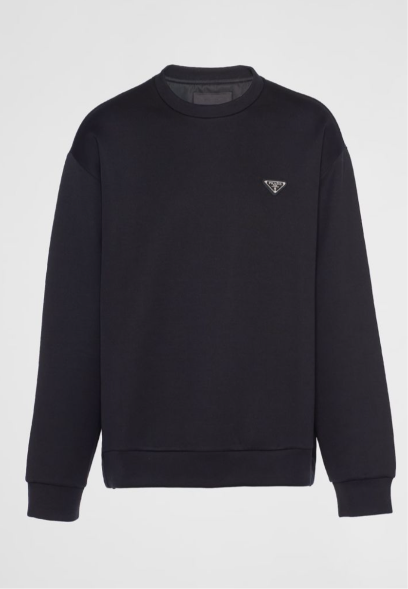 Black sweatshirt featuring a small Prada logo patch on the chest, with ribbed cuffs and hem for a stylish and cozy fit.