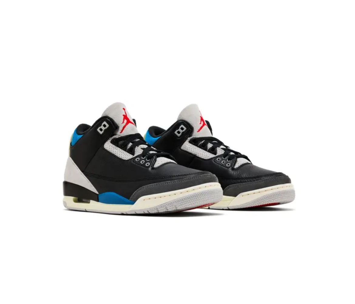 Pair of black, white, blue, and gray Air Jordan sneakers with red Jumpman logo on the tongue, displayed on a white background.