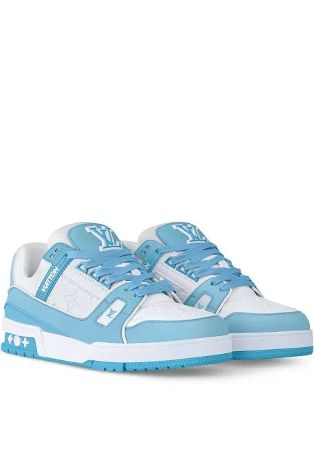 A pair of white and light blue Louis Vuitton sneakers featuring the LV logo, with blue laces and a sporty design on the sole.