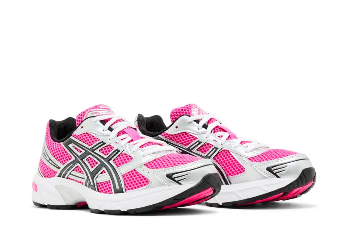 Pink and white athletic sneakers with black and silver accents, featuring mesh material and laced-up design.