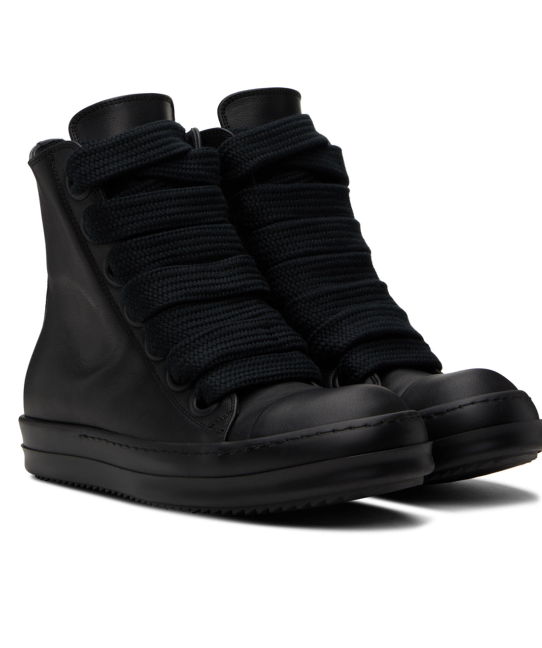 A pair of black high-top sneakers with a leather base, thick knitted laces, and a sleek, minimalist design.