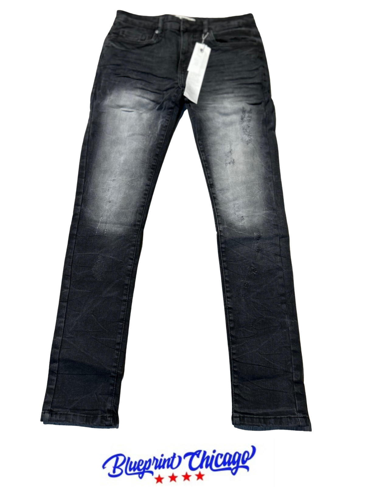 Black faded stacked jeans with light distressing, featuring a small tag on the waistband, displayed with a Blueprint Chicago logo.