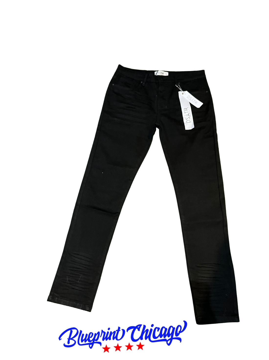 A pair of black skinny jeans with subtle distressed details on the thighs, price tags attached, and the "Blueprint Chicago" logo below.