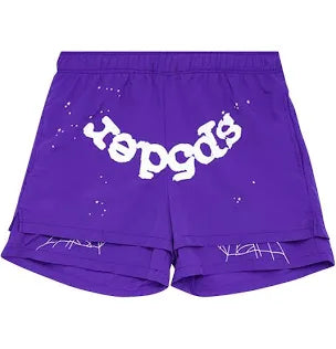 Purple shorts featuring a "Yogos" print with white accents and a graphic design at the hem, offering a stylish streetwear vibe.